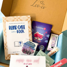 Load image into Gallery viewer, Open box containing 'Blind Date With A Book' where you can choose your own genre. The gift box includes a face mask, a card, a hand cream, a lip balm, a bar of soap and a best friends wish bracelet. There is a Leo & Co logo on the box.